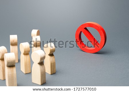 People look at red prohibition sign NO. Restriction of rights and freedoms, legislative prohibition laws and rules. Taboo, rejection. Abolition of restrictive measures under society pressure. Royalty-Free Stock Photo #1727577010
