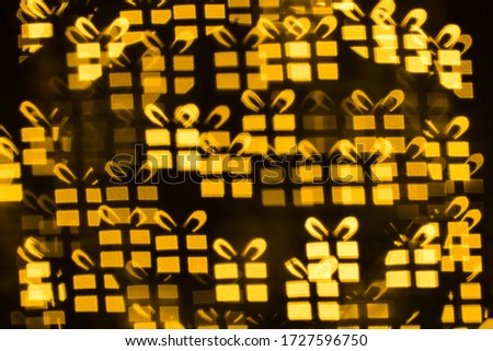 Decorative Christmas background with festive bokeh of Christmas tree lights burry out of focus