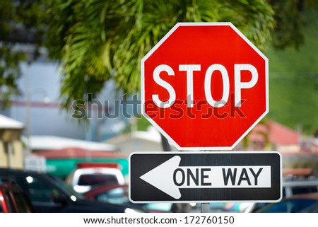 Stop and one way sign on a street