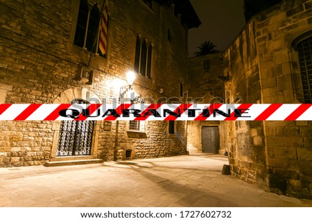 Coronavirus in Barcelona, Spain. Quarantine sign. Concept of COVID pandemic and travel in Europe. Gothic quarter at night