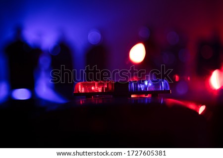 Corona virus concept with police. Stay home for precautionary measures to prevent from corona virus. Anti-riot police give signal to be ready. Smoke on a dark background with lights. Selective focus Royalty-Free Stock Photo #1727605381