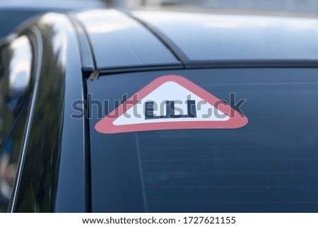 Russian 'Studded tire' Sign at the back of a car (Russian: Знак Ш).