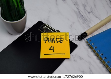 Phase 4 write on sticky notes isolated on office desk