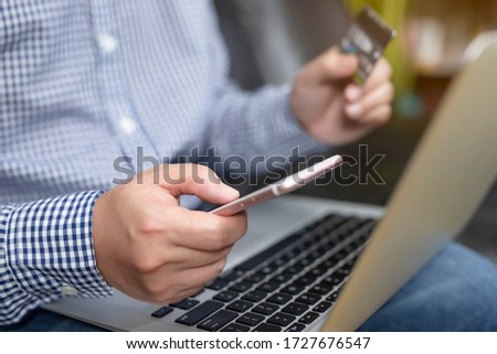 A man shopping online via credit cards.Business and Technology Concepts.