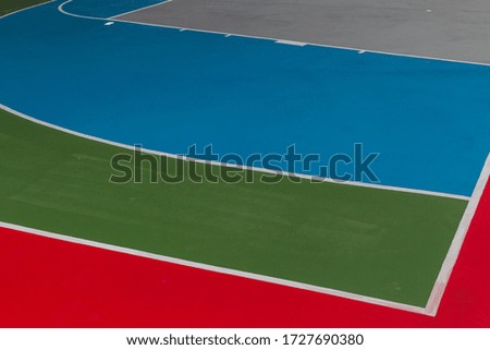 The floor of the basketball court is red, green, blue and gray. That is being completed For students Students get exercise For a healthy body