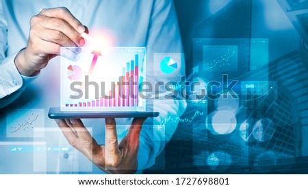 Businessman using tablet and technology. Digital marketing of Sales and Economic growth graph chart. Business strategy Abstract graphic background