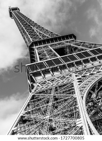 Down view of the eiffel tower in Black and white.