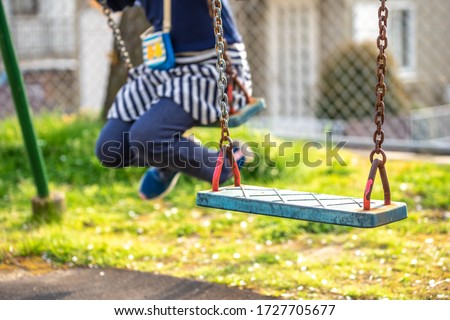 Swing seat in the park Royalty-Free Stock Photo #1727705677