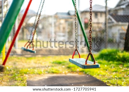 Swing seat in the park Royalty-Free Stock Photo #1727705941