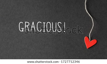 Gracious - Thank you in Spanish language with handmade small paper hearts Royalty-Free Stock Photo #1727712346