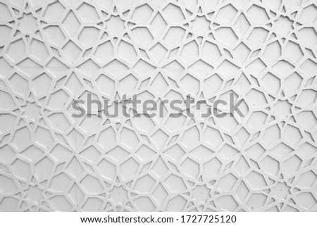 closeup of a wall of white with islamic ornament
