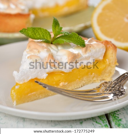 Pie with meringue on a white background closeup