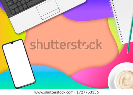 Work at home. Top view office desk table with Smart phone, Chart, Notepad, Laptop, Technology and Supplies. Concept photos of desks. Commercial background. 
