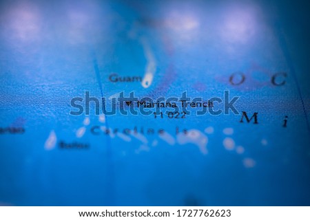 Geographical map location of Mariana Trench off coast of Philippines Pacific Ocean on atlas Royalty-Free Stock Photo #1727762623