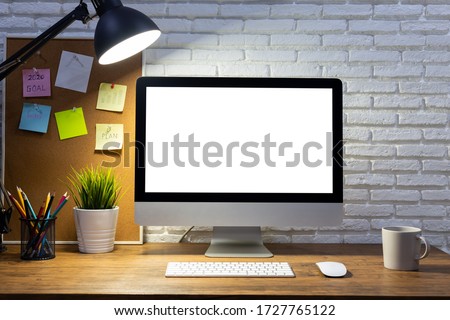 workspace with computer with blank white screen mockup, and office supplies on a wooden desk Royalty-Free Stock Photo #1727765122