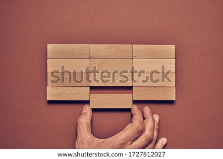  Business concept wooden blocks arranged in a conceptual image                              