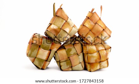 Ketupat (Rice Dumpling) special dish served at Eid Mubarak.On White Background. Ketupat is a natural rice casing made from young coconut leaves for cooking rice during eid Mubarak, ied al Fitr