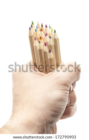 Hand holding some color pencils