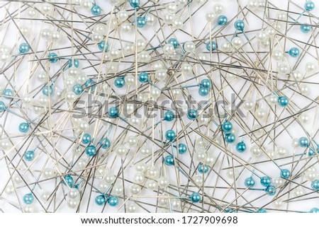 pink pins on white background