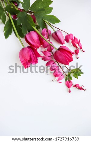 greeting card mockup. floral arrangement of pink flowers on a white background. congratulation. invitation. flat lay