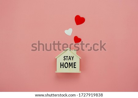 Table top view aerial image of STAY AT HOME work background concept quarantine of coronavirus,covid-19. Flat lay of home toy wooden with word and red heart.Healthcare & medical,work from home.