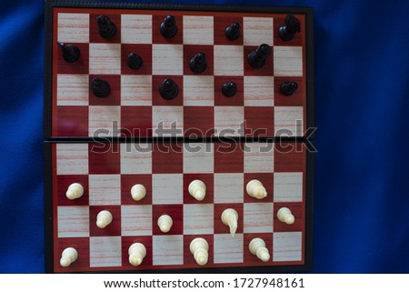 black and white chess stand on a chessboard