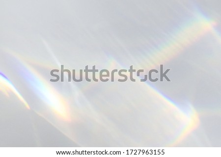 Blurred water texture overlay effect for photo and mockups. Organic drop diagonal shadow and light caustic effect on a white wall. Shadows for natural light effects Royalty-Free Stock Photo #1727963155