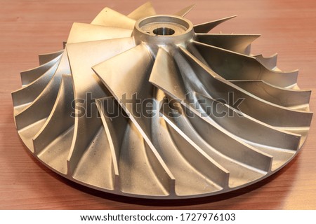 Impeller from a centrifugal compressor, disassembled and rejected due to quality requirements Royalty-Free Stock Photo #1727976103