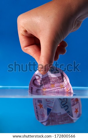Economy Recovery Concept: Hand helping a EURO bill boat