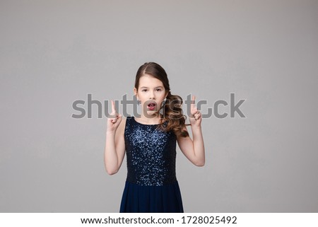 Portrait of beautiful young girl is shocked, picture isolated on white background