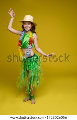 Pretty girl in Hawaiian costume and hat.