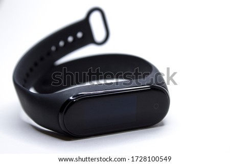 Fitness wrist bracelet. Modern technologies for monitoring health. Electronic watch with interchangeable bracelet. Icholated on a white background.
