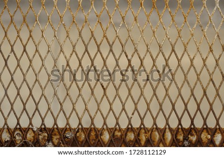 Pictures of rusty metal wire mesh are made from steel wire, grids, cages and fences made of it. It is widely used in agriculture, industry