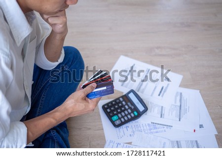 Business men sitting stressed out with home expenses and monthly credit card debt. Royalty-Free Stock Photo #1728117421