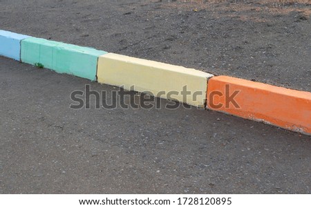 colored curbs painted in bright colors