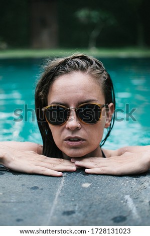 Young Woman In Swimming Pool