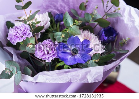 a bouquet of blue, white and lilac flowers. large chrysanthemums.
