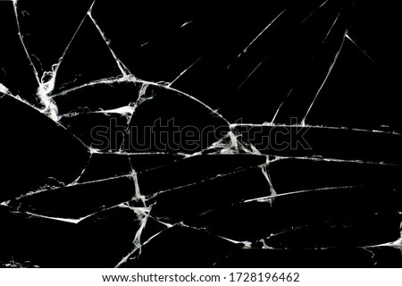Broken black glass, with white lines on black glass.