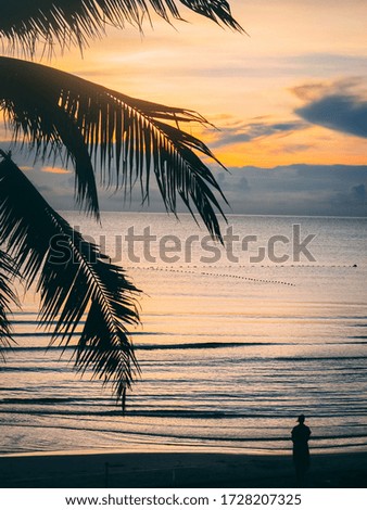 Sunset over the Sea on a Beach in Thailand