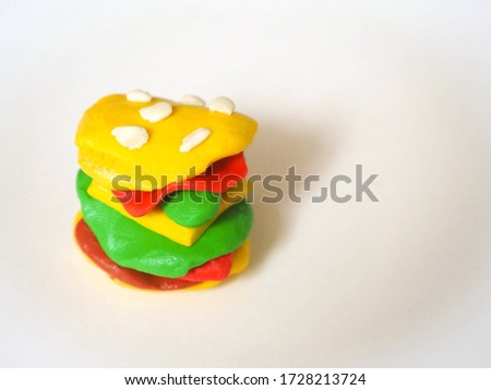 Children crafts from plasticine fastfood - hamburger