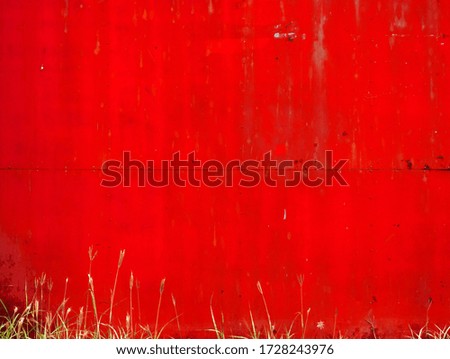    Steel zinc sheet fence painted red color, background                         