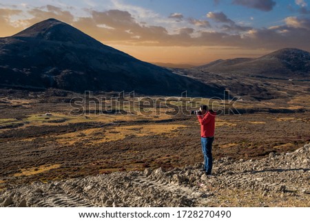 Nature photographer taking photos in the mountains.