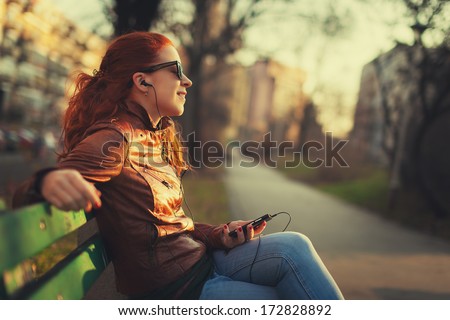Young woman using a smart phone outdoors