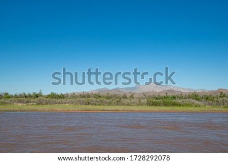 Virgin Peak beyond the banks of the Virgin River in the stunning landscape image from Clark County, Nevada, USA Royalty-Free Stock Photo #1728292078