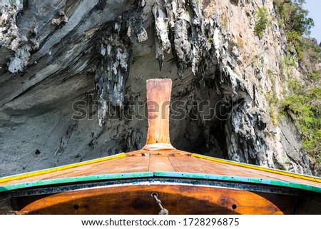 POV front of a longtail boat with limestone rocks in the background, Phang Nga Bay, Thailand