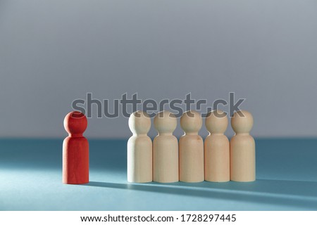 Stay away from people. Social distance. Quarantine period. Stay home be safe. Red wooden figure stand away from crowd Royalty-Free Stock Photo #1728297445