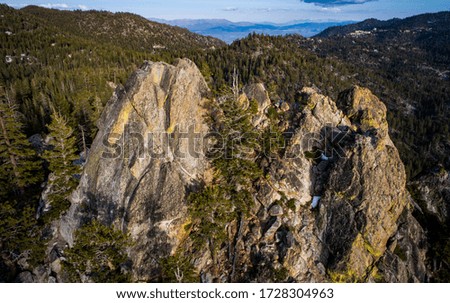 Castle Rock Mountain in the Sierra Nevada Mountains near Lake Tahoe , California , USA aerial drone views of the amazing outdoor landscape
