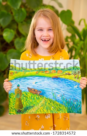 cheerful little girl in a yellow dress with a pattern depicting the end of the war standing in house on a background of flowers. congratulations with holidays, victory day. Children creativity.