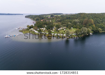 Camping site at the lake from above