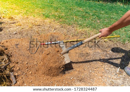 Man digging the ground and making gardening on a sunny. Eco earth day concept. Eco friendly. Save the planet. Gardening concept. Make your own garden. 